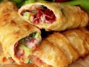 Pastry rolls with pastirma, cheese and vegetables